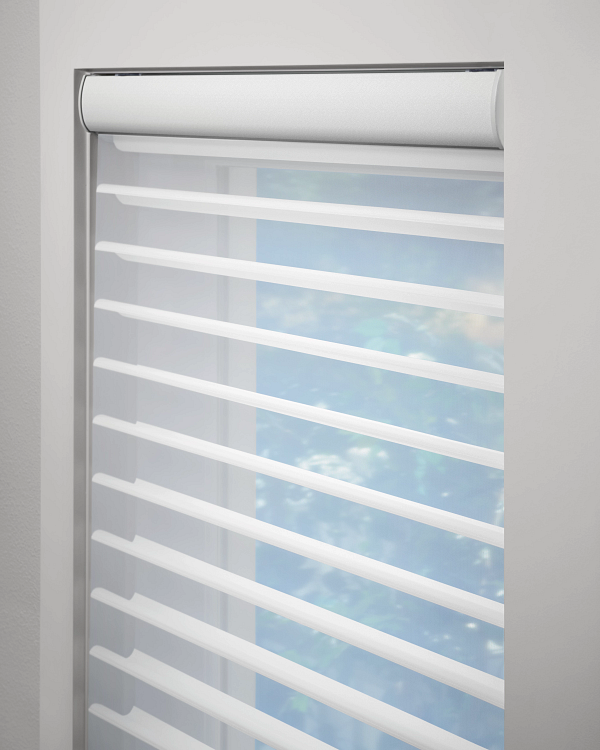White horizontal blinds partially open, letting light through with a blue sky visible outside