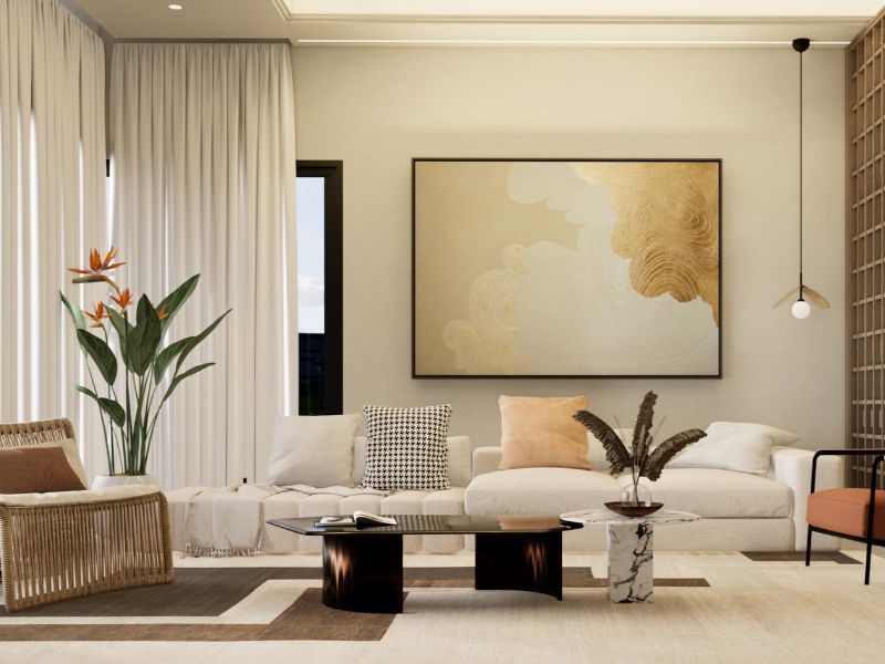 Modern living room with beige sofa, abstract wall art, black coffee table, and plants in a bright neutral interior
