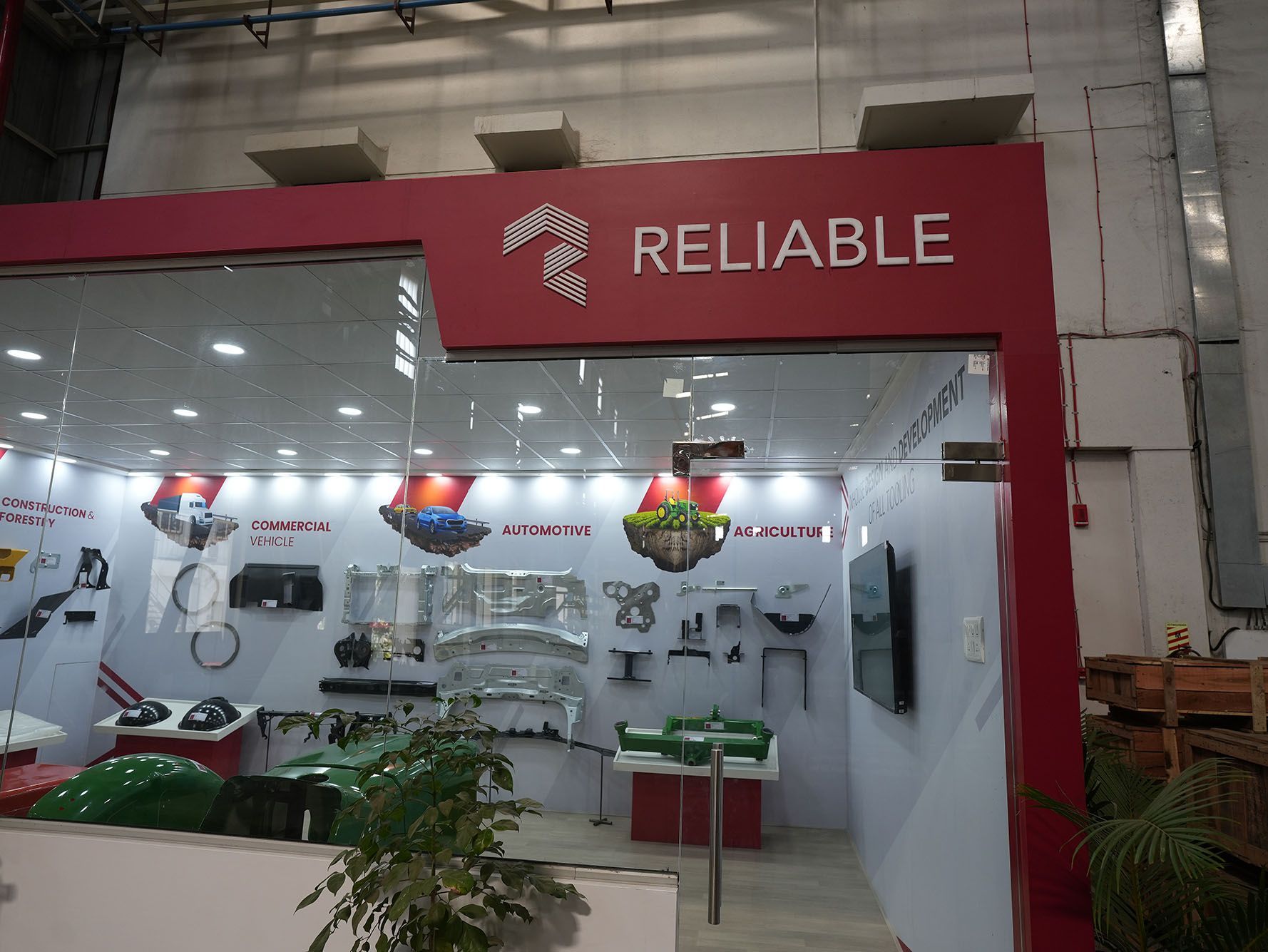 Red storefront labeled “RELIABLE” with tools and hardware on display inside
