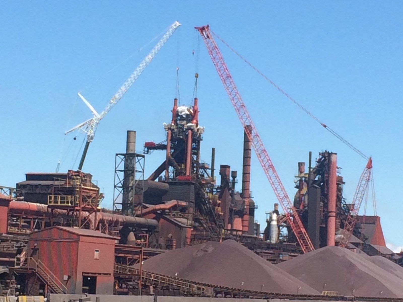 A large industrial area with lots of cranes and buildings