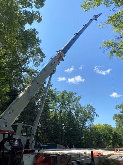A large crane sitting on top of a construction site.