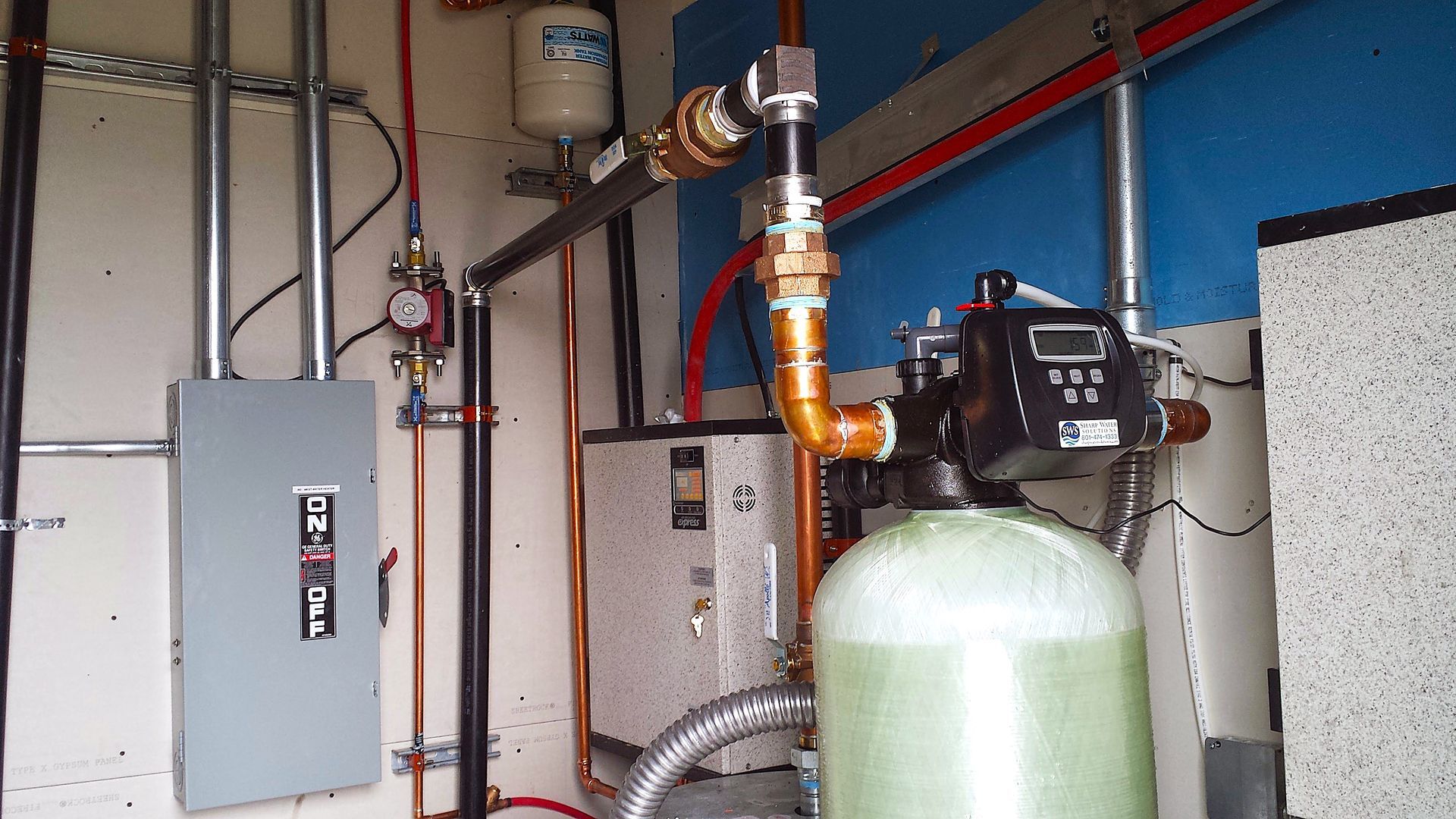 New water treatment system installed by Sharp Water Solutions in Salt Lake Valley, for softer skin and spot-free dishes.