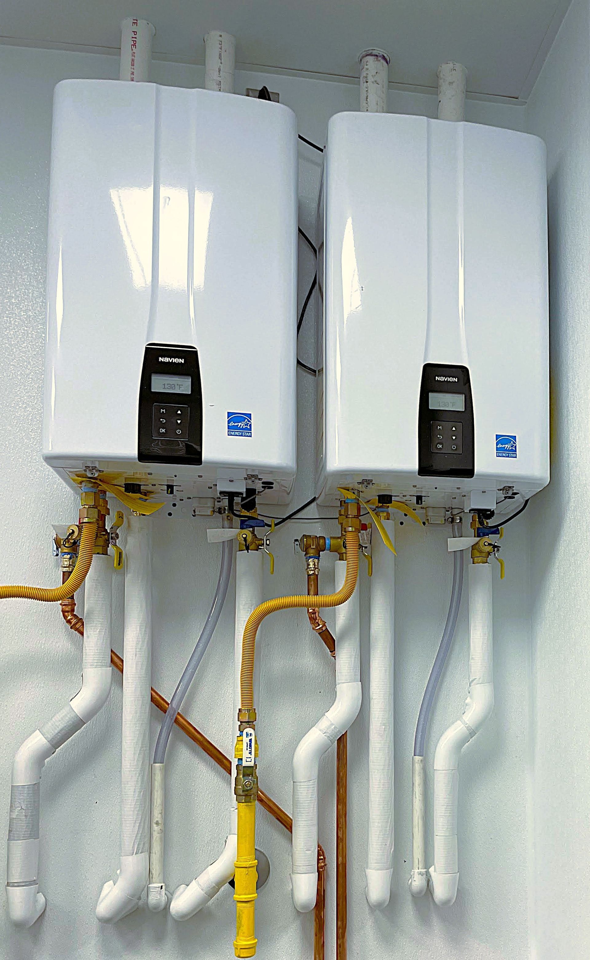 Sharp Water Solutions putting in tankless water heaters in Sandy UT basement. This system is made for Utah's hard water