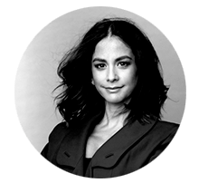 A black and white photo of a woman in a circle.
