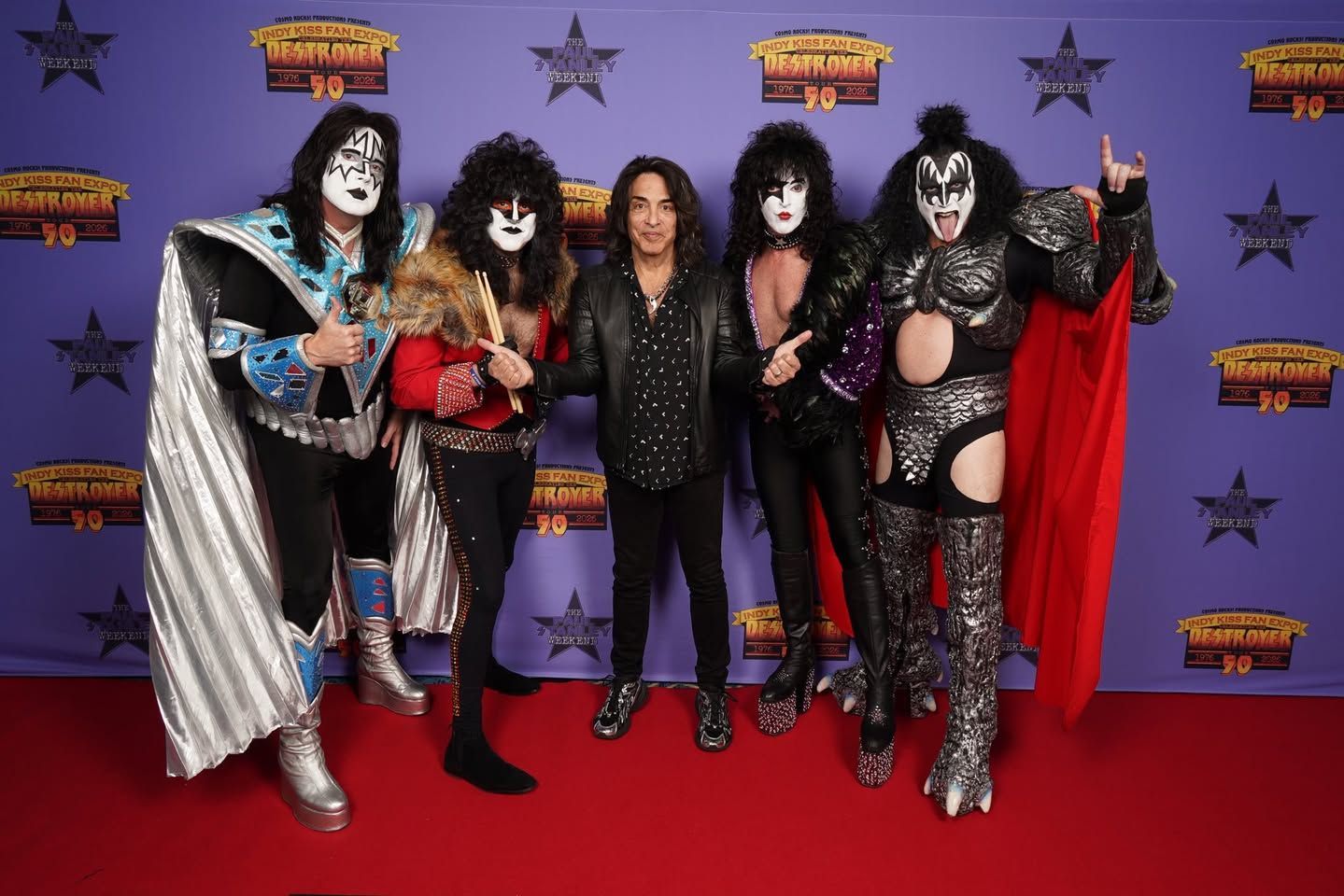 Mr. Speed posing with Paul Stanley in the center at the Indy KISS Expo 2026