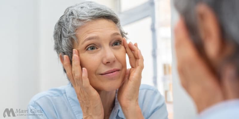 Senior Woman Checking Her Skin — Dearborn, MI — Masri Clinic Senior Woman Checking Her Skin — Dearborn, MI — Masri Clinic