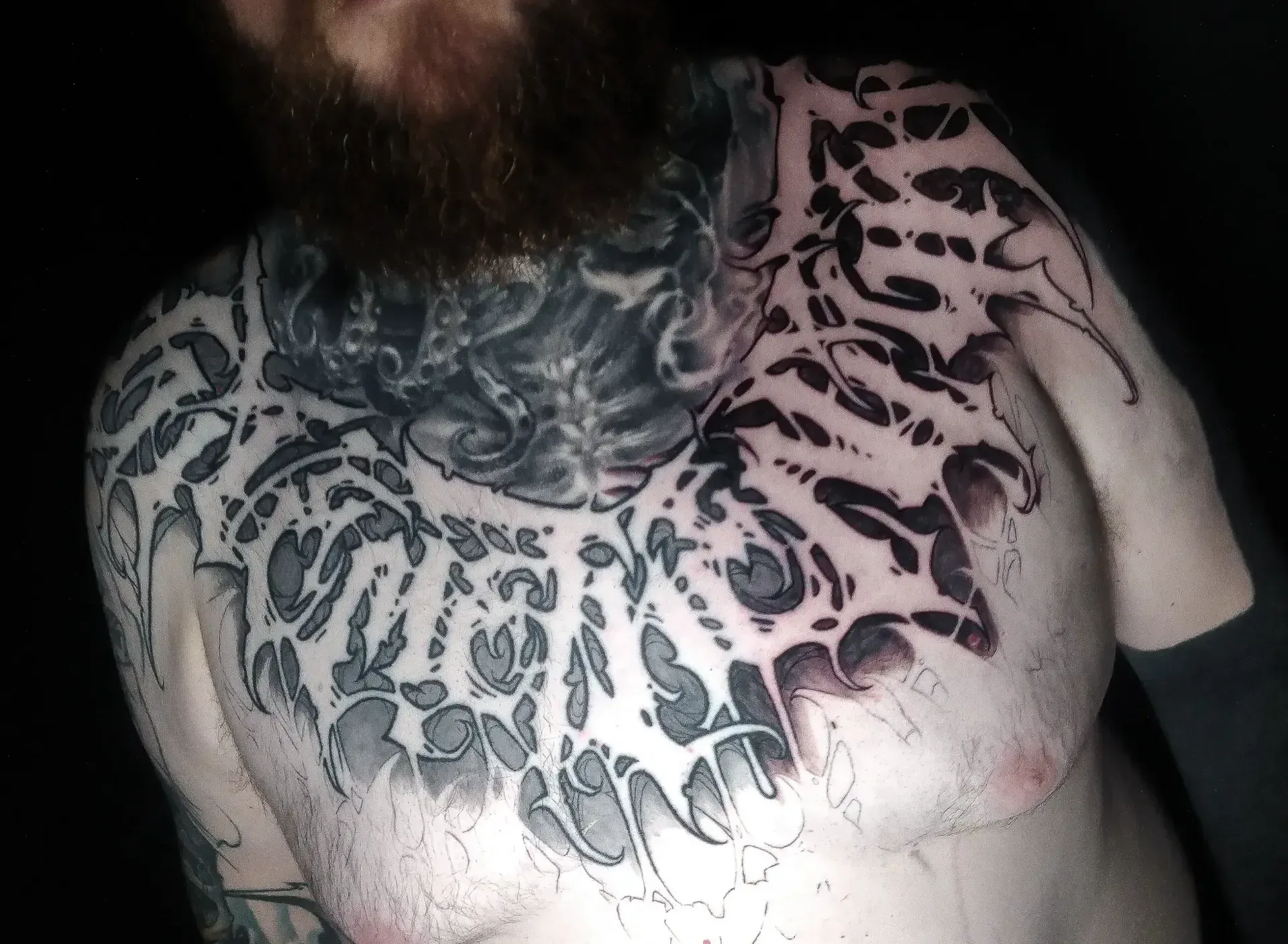 Dark freehand tattoo — bio-organic design
drawn directly onto skin by Crawlspace Tattoo Artist based in London
