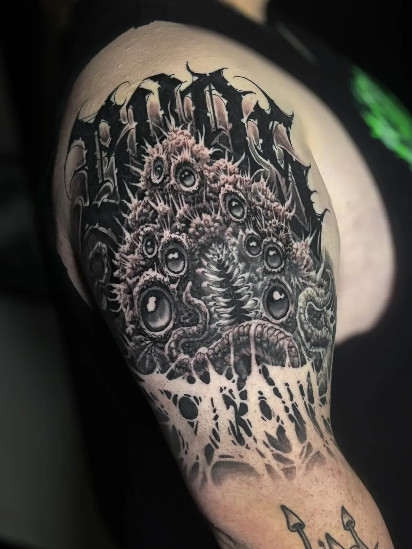 Dark surrealism freehand tattoo — bio-organic design
drawn directly onto skin