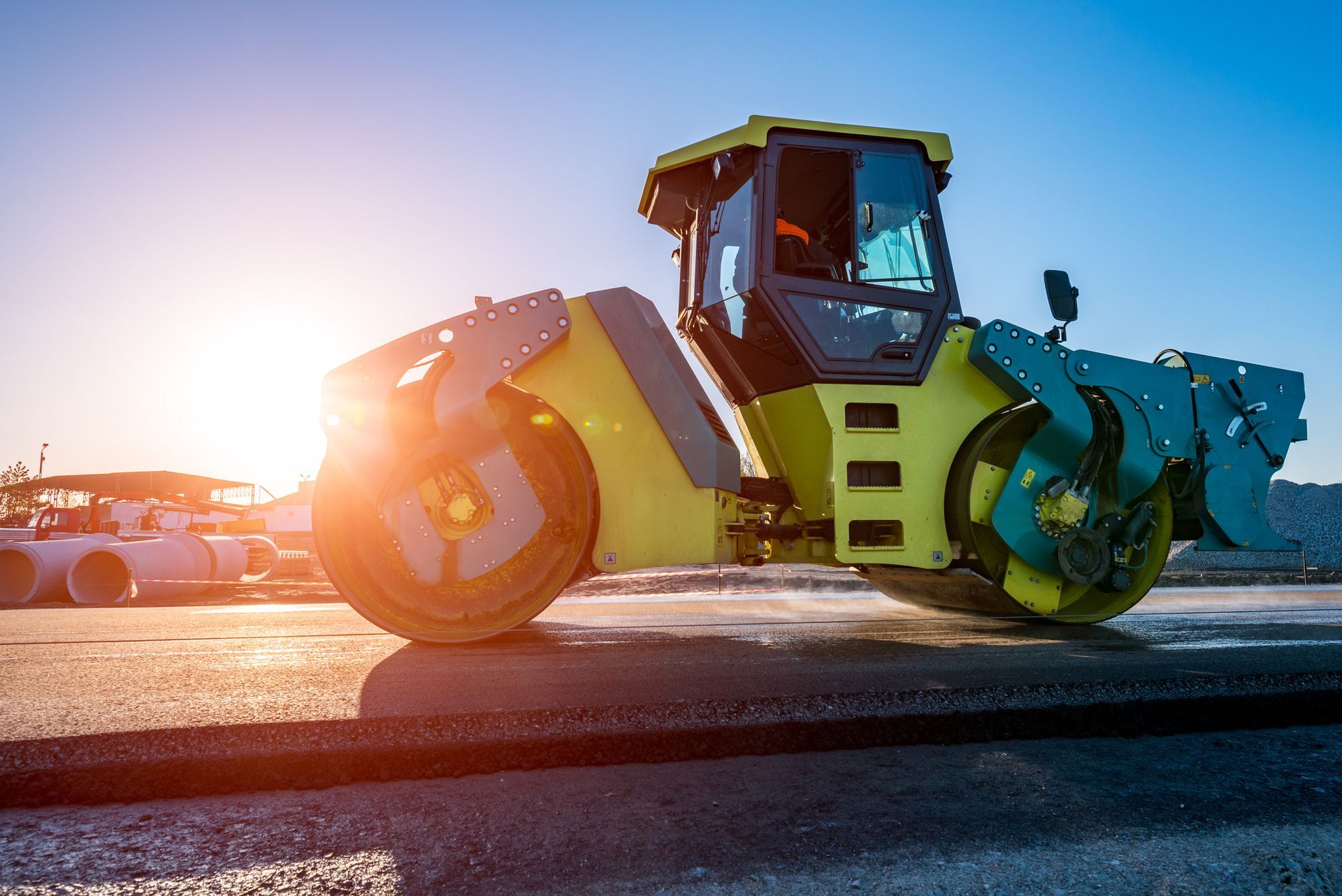 the road roller working on the construction site for a Commercial Asphalt Paving Contractor