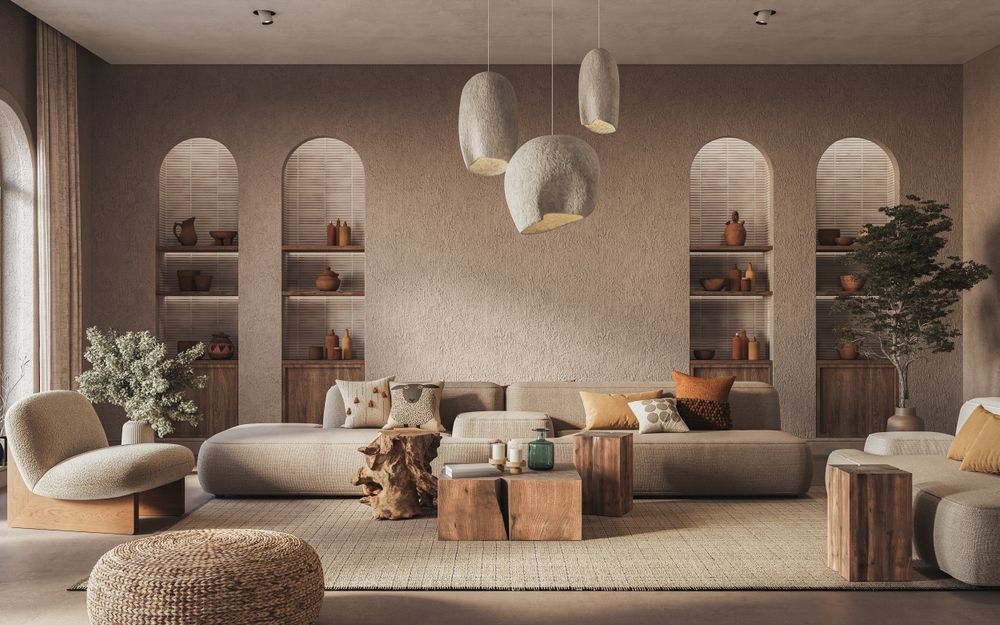 Cozy beige living room with arched shelves, low sofa, poufs, plants, and hanging pendant lights