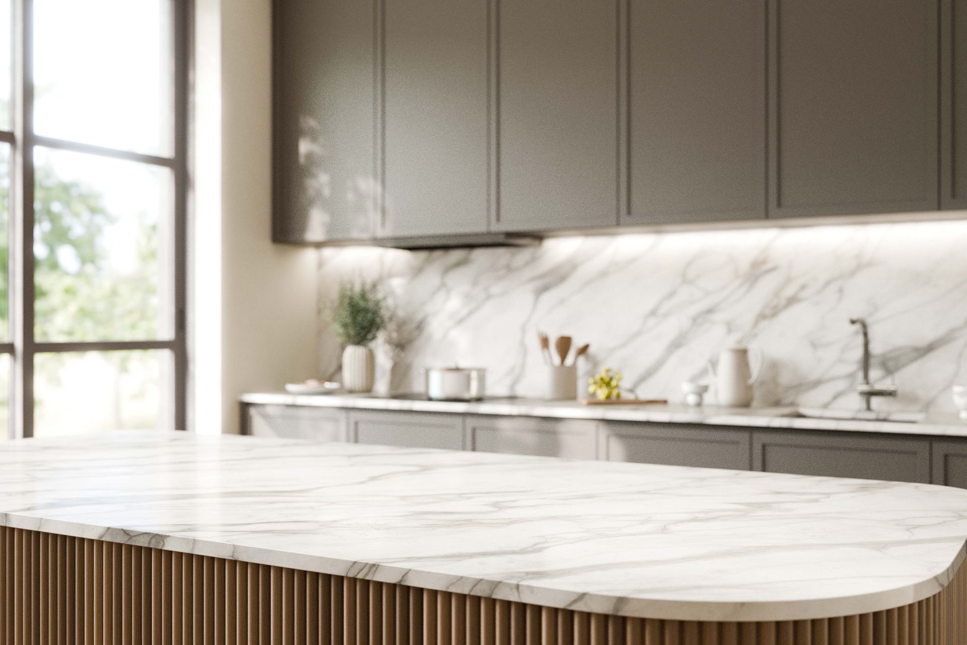 Modern kitchen with marble island, white backsplash, and large window light