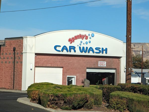 A car wash is located in a brick building
