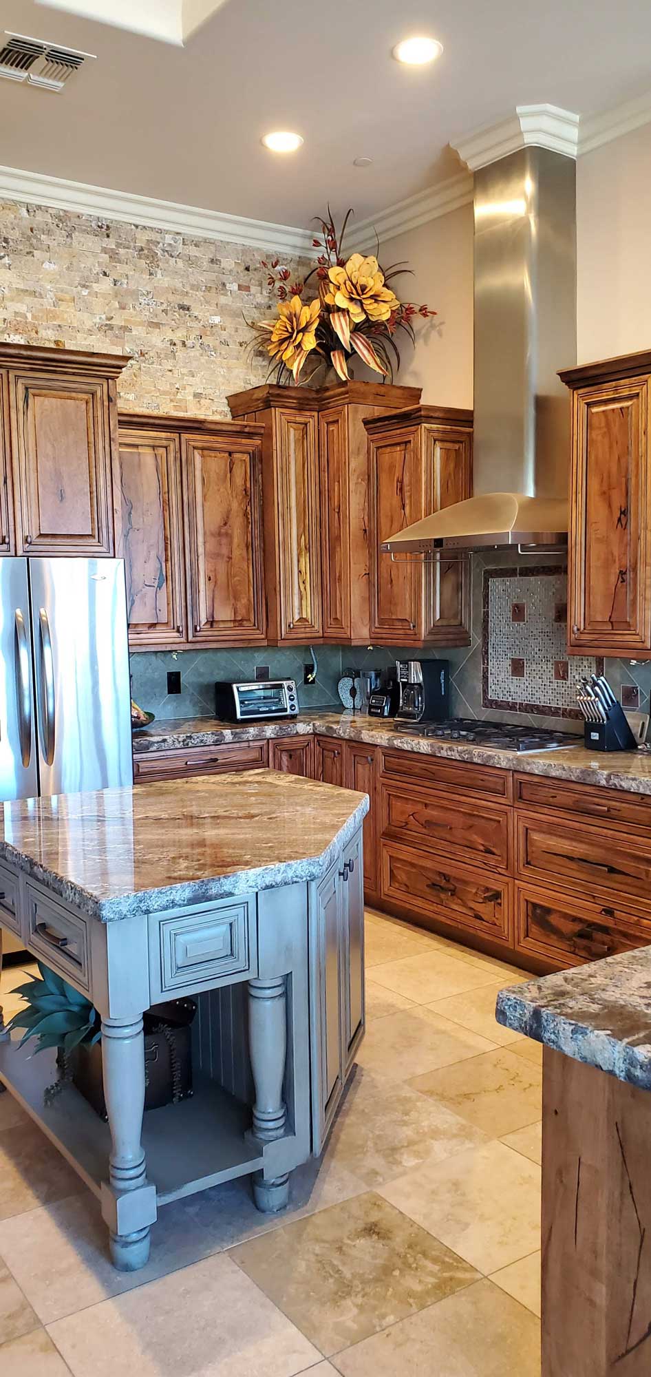 A well-equipped kitchen with stainless steel appliances and a large island