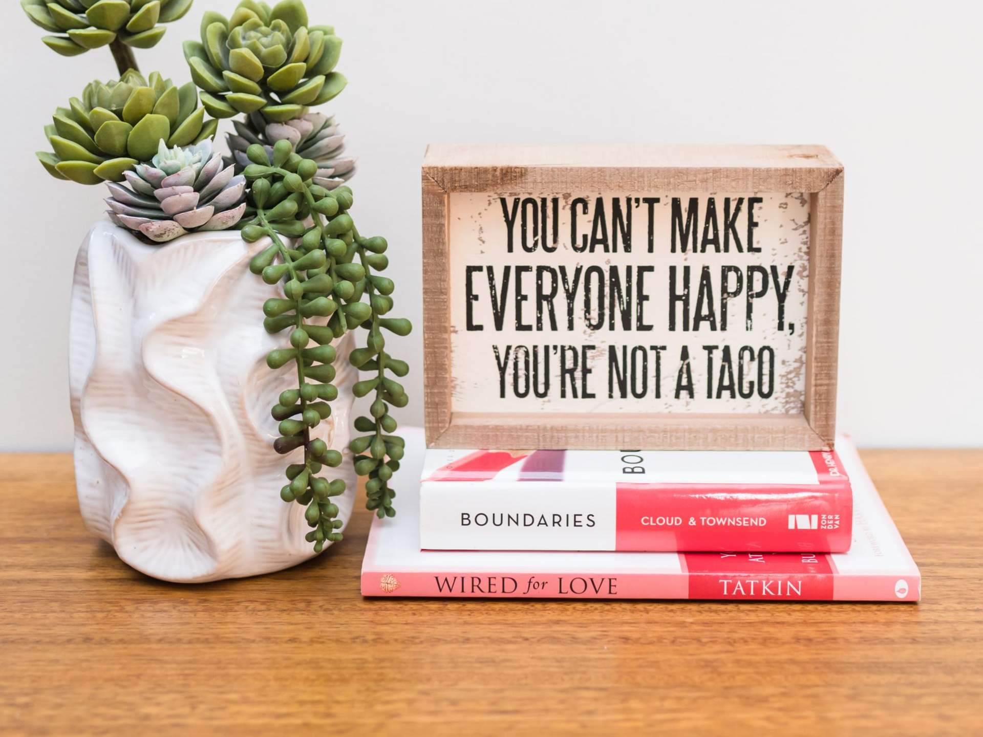 Succulents, a sign that says 