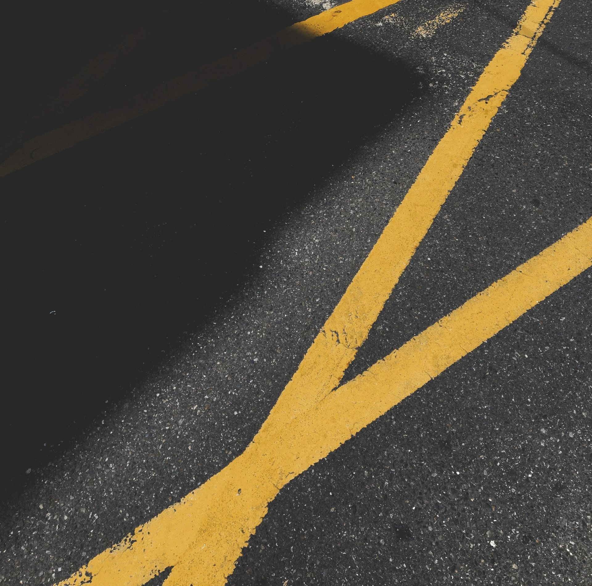 A close up of a yellow line on the road