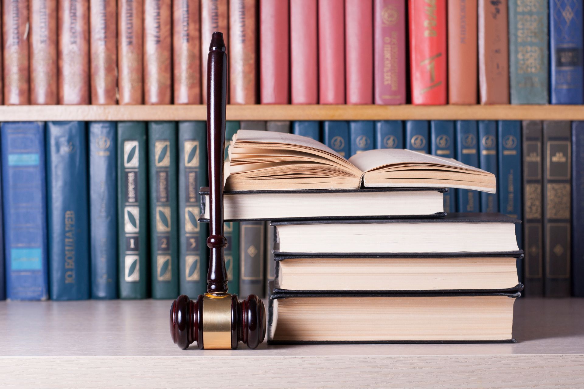 Book with wooden judges gavel on table from The Ritchie Law Group in ethany Mo