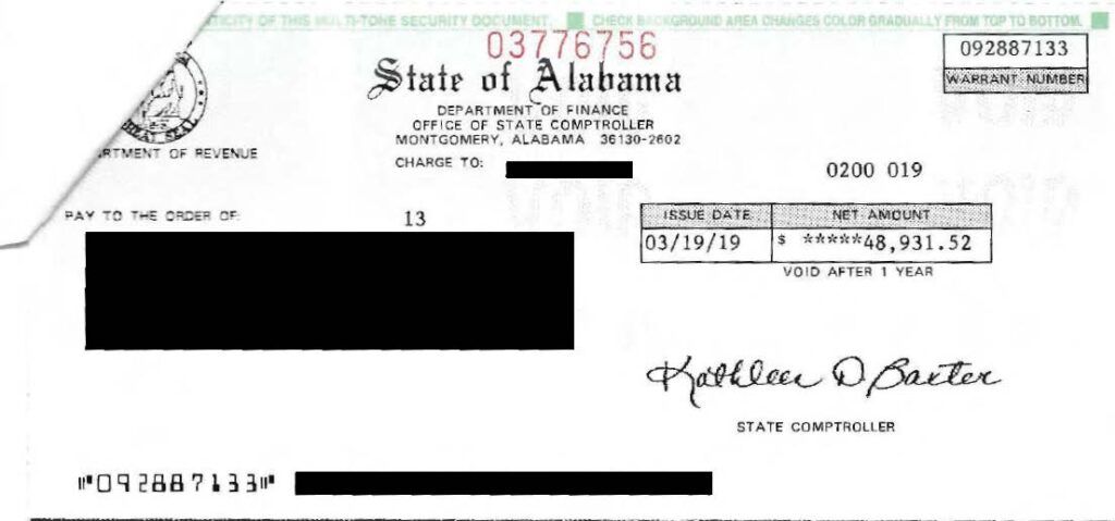 Alabama state paycheck/check with signatures and amounts, partially redacted