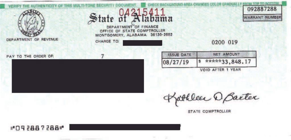 Printed Alabama state check with handwritten signature and redacted personal details