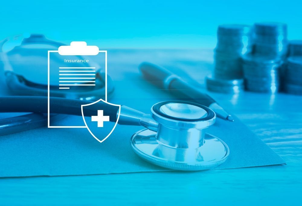 Doctor’s stethoscope and medical icons on a blue desk background