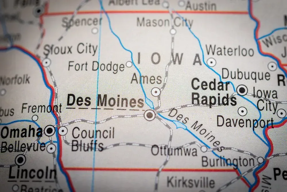 Map of Iowa and surrounding cities with red borders and black city labels.