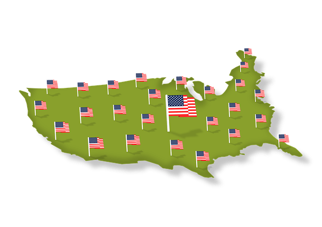 Map of the United States with multiple small American flags and one large flag in the center
