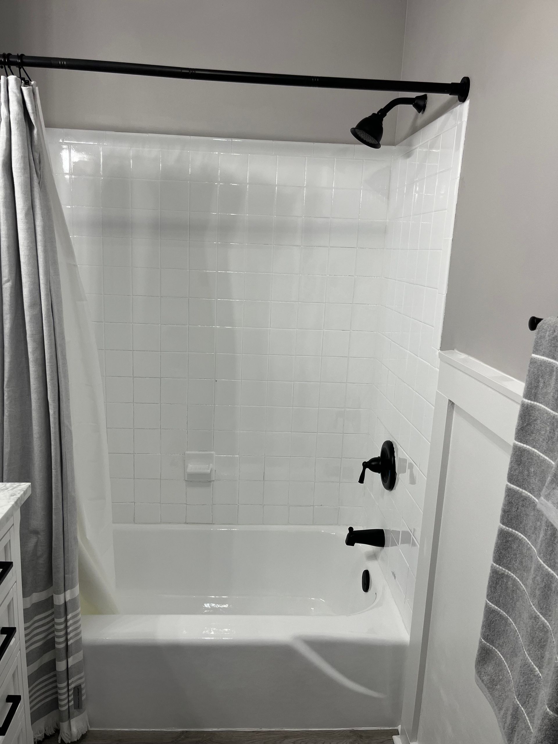 A bathroom with a bathtub and a shower.