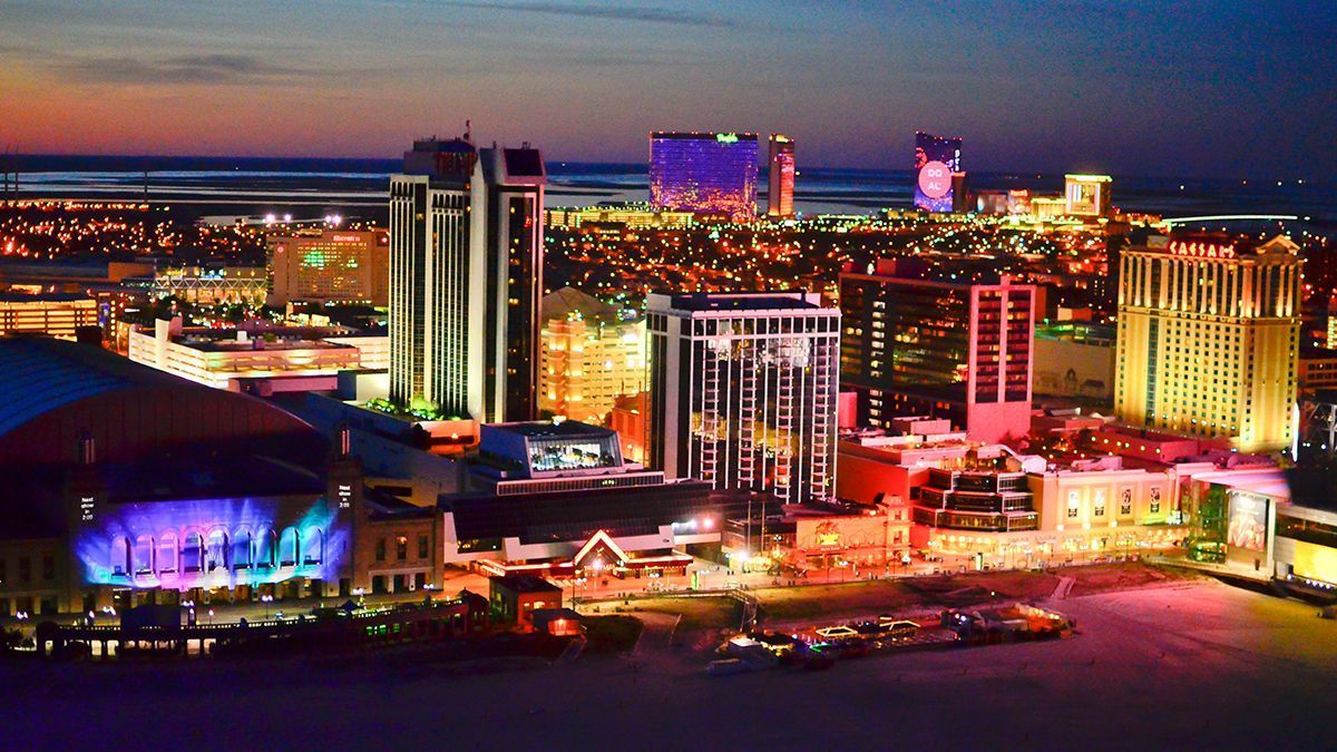 An aerial view of atlantic city, new jersey at night with many casinos lit up