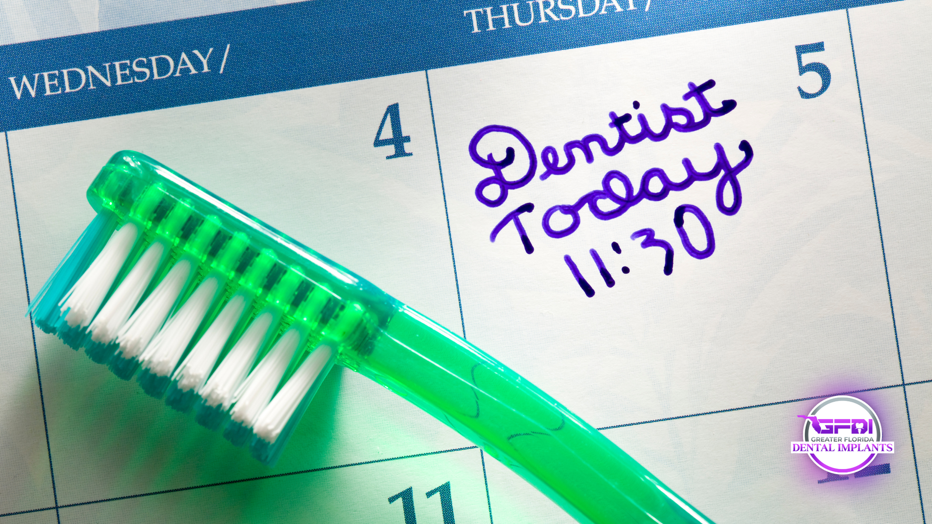 Green toothbrush on a calendar marked 