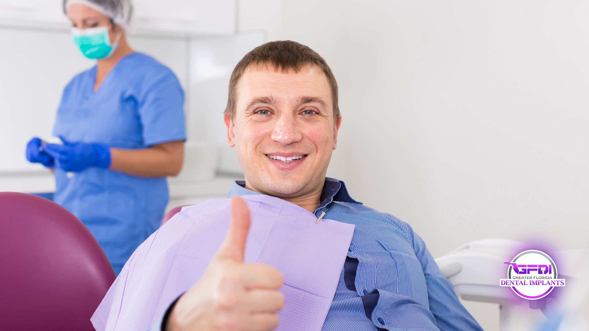 Dental patient smiling and giving a thumbs-up in a clinic, with a dentist in scrubs in the background