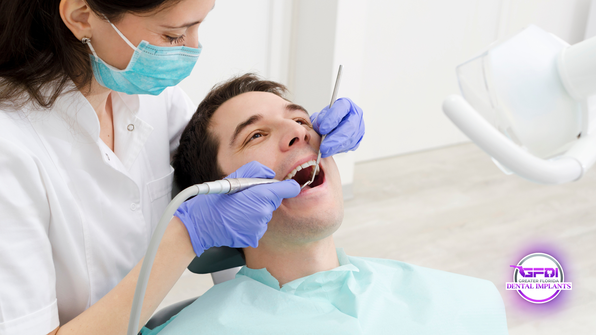 Dentist examining patient's teeth with dental tools in a bright, clinical setting.
