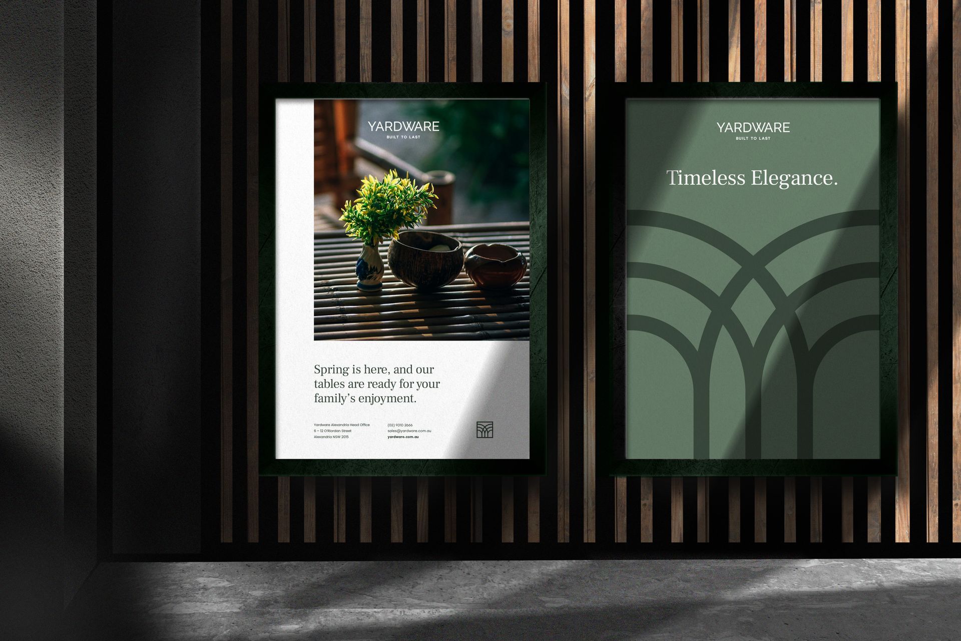 Two posters are hanging on a wall next to each other.