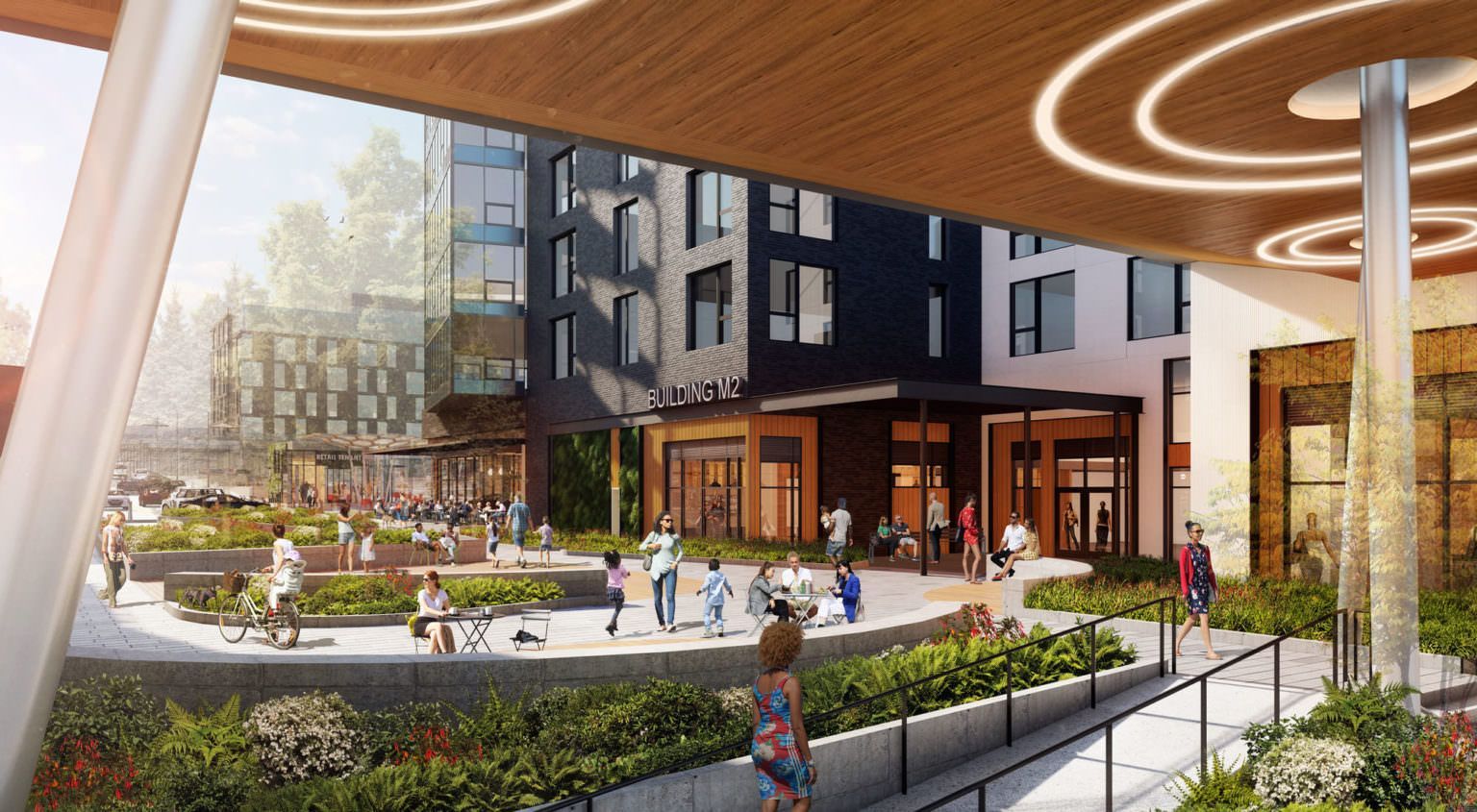 A vibrant outdoor plaza with people walking, sitting, and socializing in front of a modern, multi-story building.
