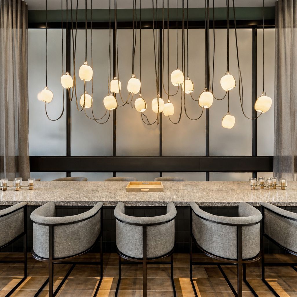 large table with seating and large chandelier 