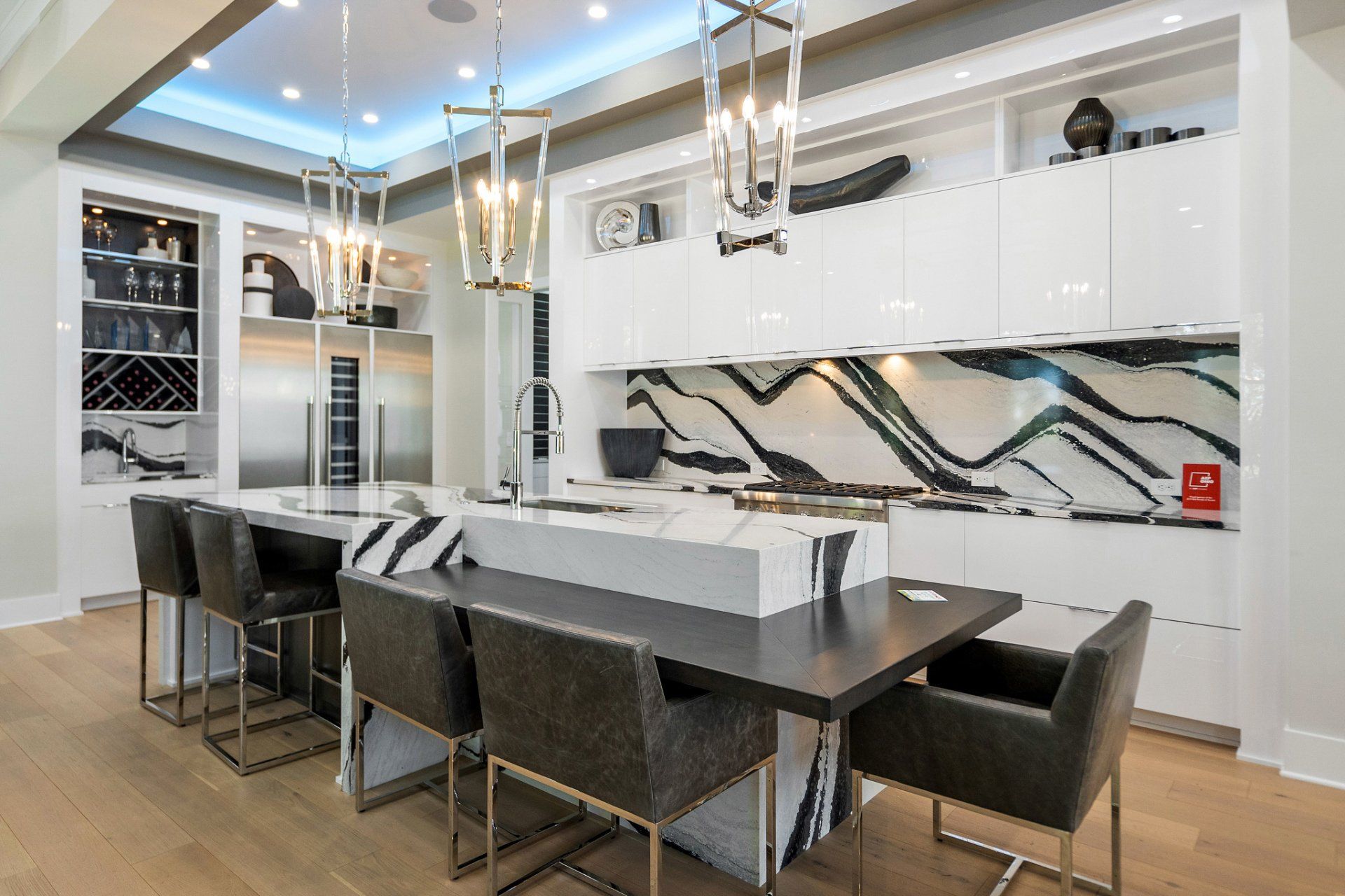 A kitchen with a table and chairs in it