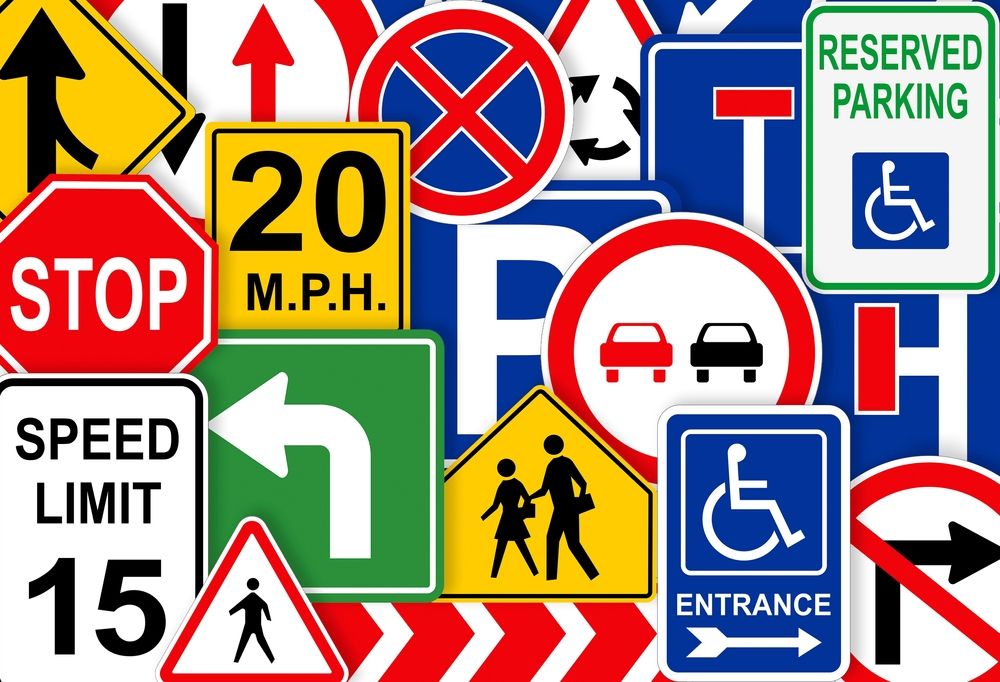 Assorted road signs, including speed limits, stop, turn, school zone, no parking, and accessible parking.