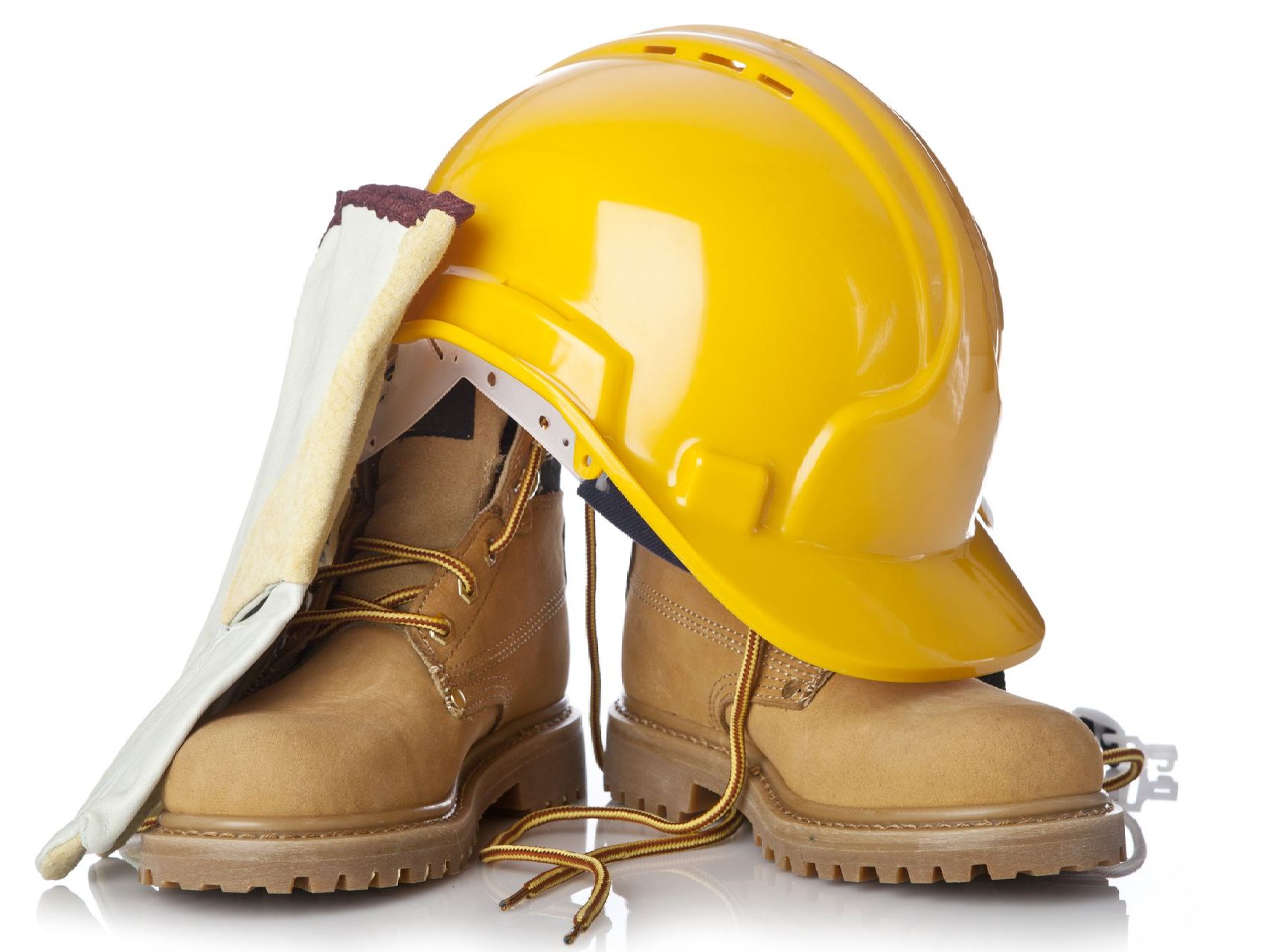 Yellow hard hat, work boots, and glove on a white surface.