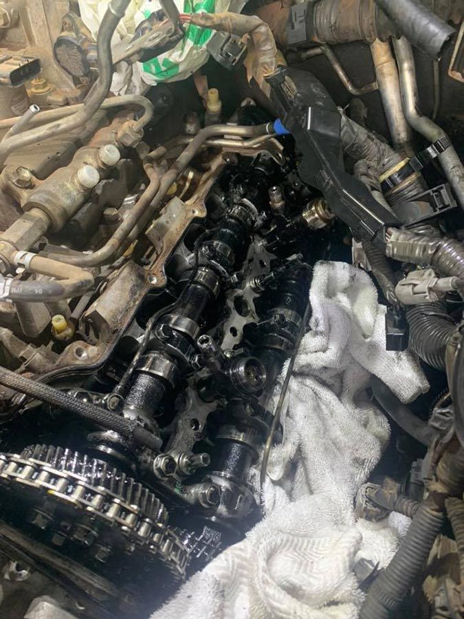 A Close Up Of A Car Engine With A Towel On Top Of It — Dieselflash Whitsundays in Proserpine, QLD