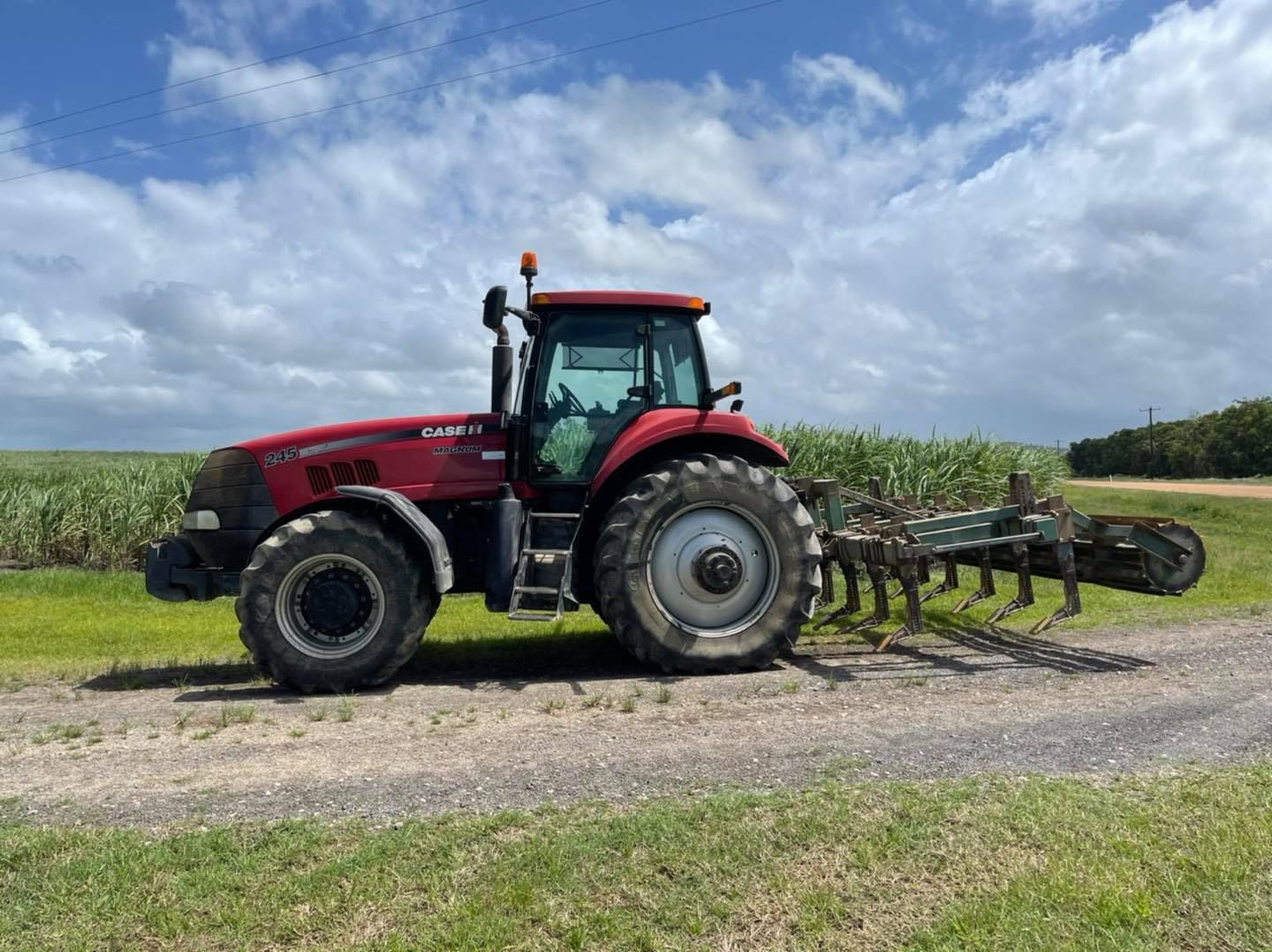 Red Tractor With Attached Plow — Dieselflash Whitsundays in Proserpine, QLD