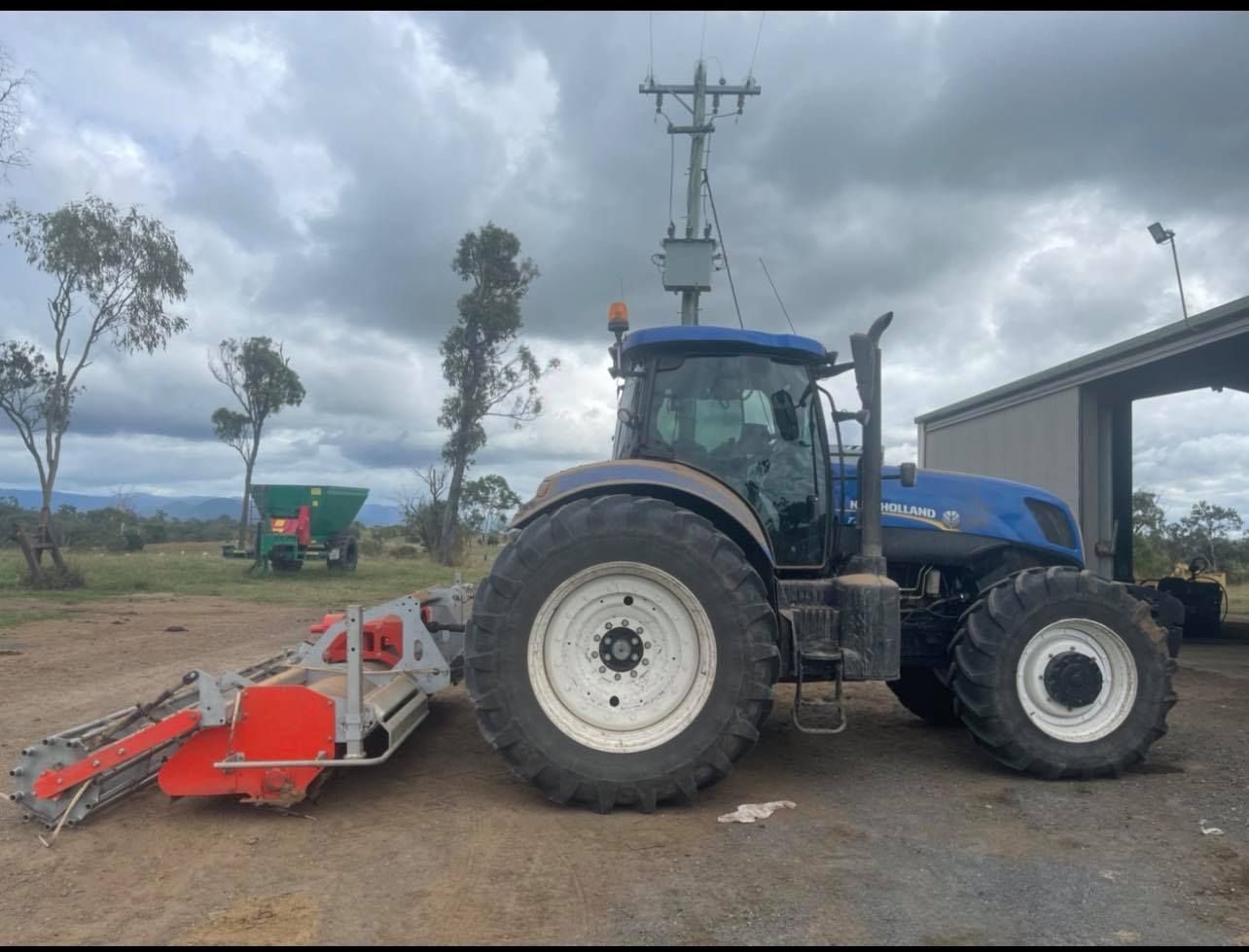 Blue Tractor With Rear Mower — Dieselflash Whitsundays in Mackay, QLD
