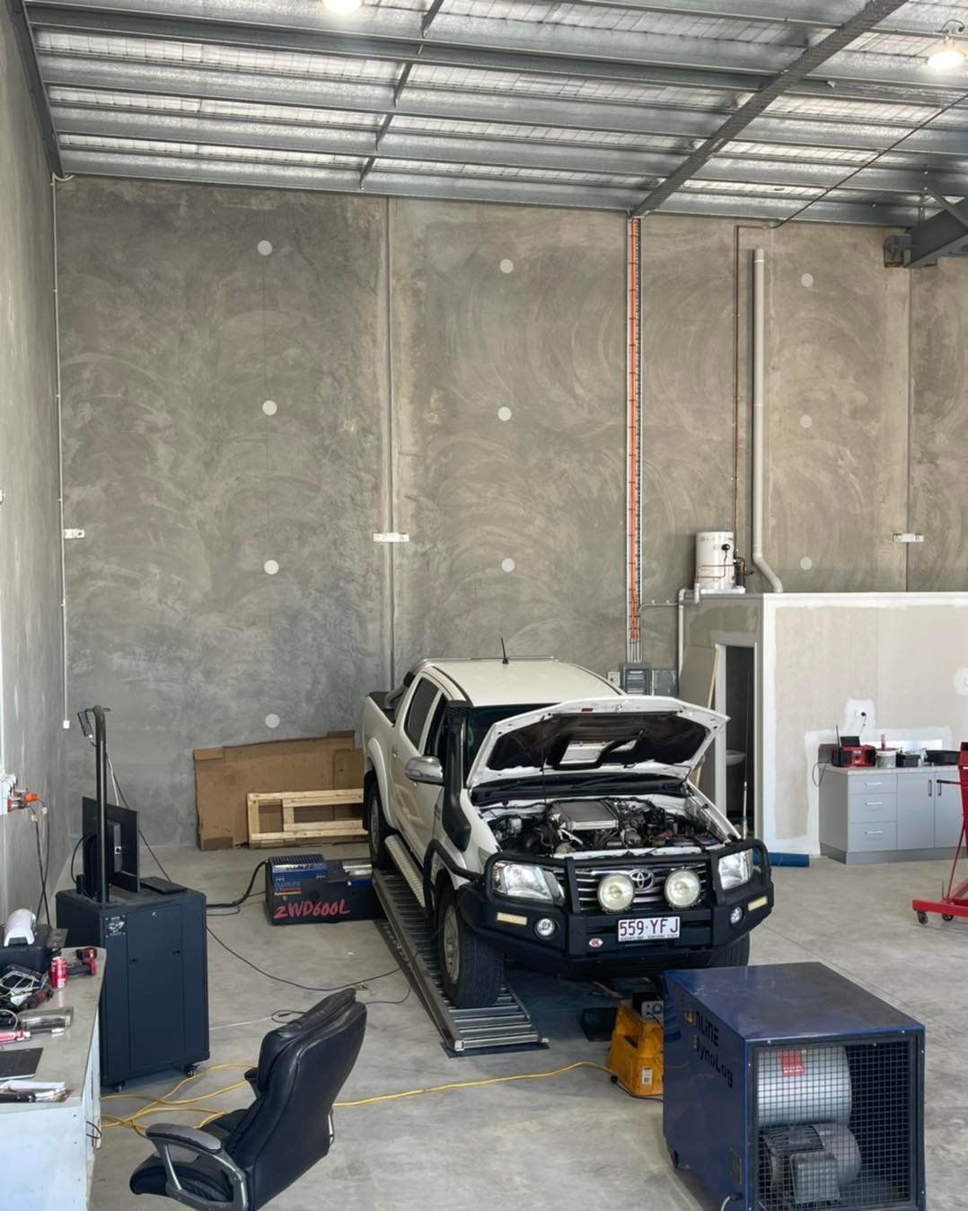 A Truck Is Parked In A Garage With Its Hood Up — Dieselflash Whitsundays in Mackay, QLD
