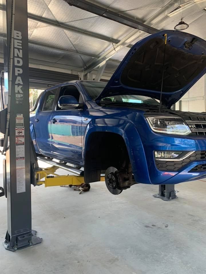 A Blue Truck Is Sitting On A Lift In A Garage — Dieselflash Whitsundays in Airlie Beach, QLD