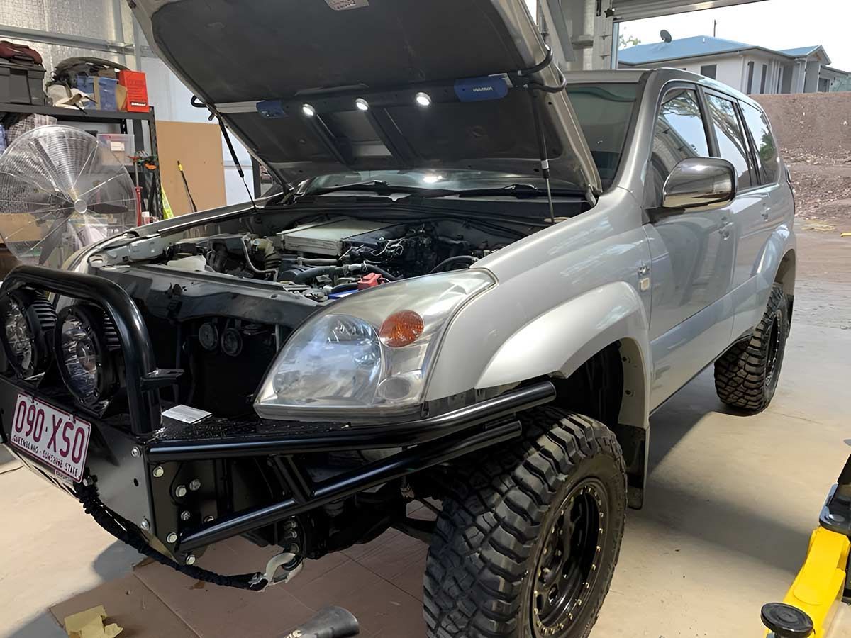 A Silver SUV With The Hood Up Is Parked In A Garage — Dieselflash Whitsundays in Airlie Beach, QLD