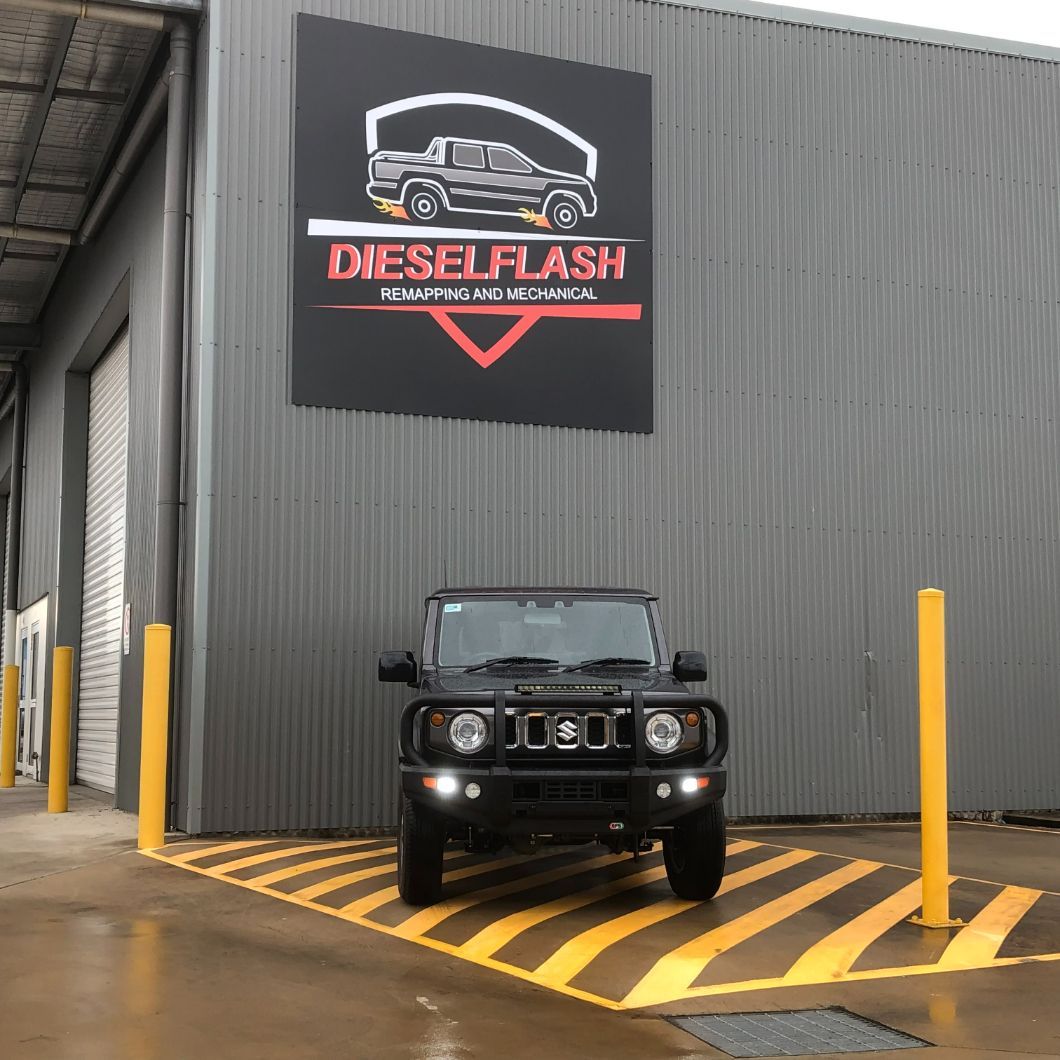 A Truck is Parked in Front of a Diesel Flash Sign — Dieselflash Whitsundays in Proserpine, QLD