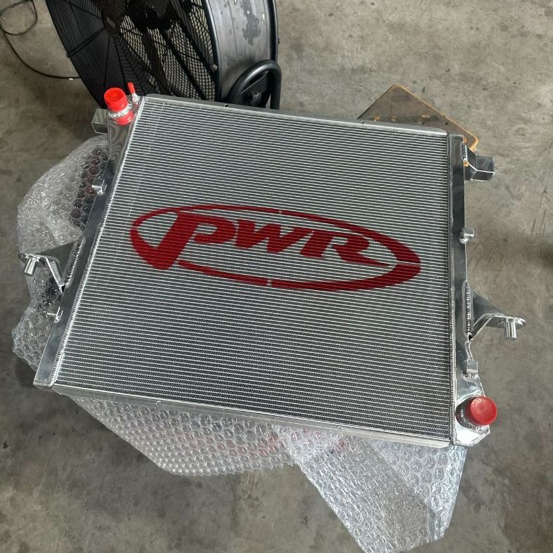 An Aluminum Radiator With Pwr Written on It — Dieselflash Whitsundays in Proserpine, QLD