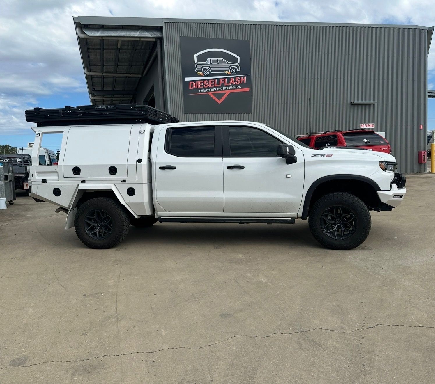 White Flatbed Truck Parked Outdoors — Dieselflash Whitsundays in Proserpine, QLD