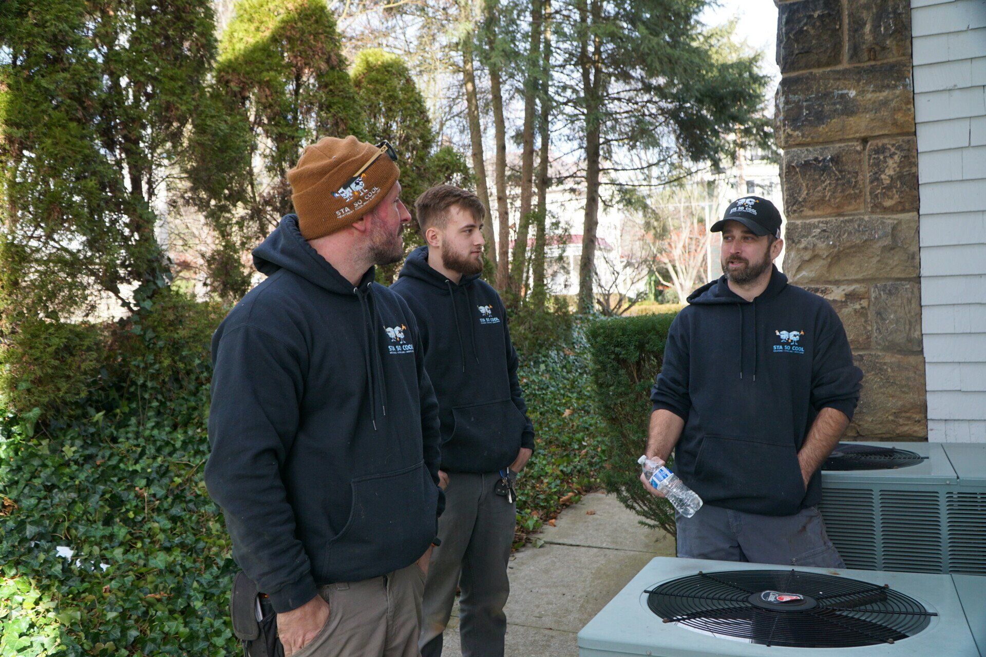Three Air Conditioner Workers Checking the Unit — Sewickley, PA — Sta So Cool HVAC Three Air Conditioner Workers Checking the Unit — Sewickley, PA — Sta So Cool HVAC