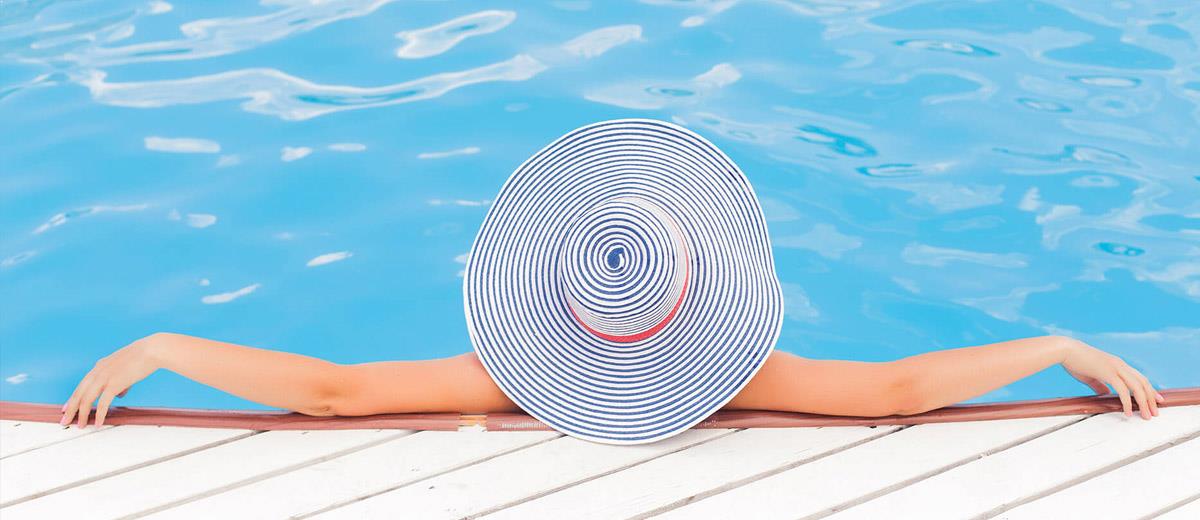 Woman in Hat Relaxing at Swimming Pool — Sewickley, PA — Sta So Cool HVAC