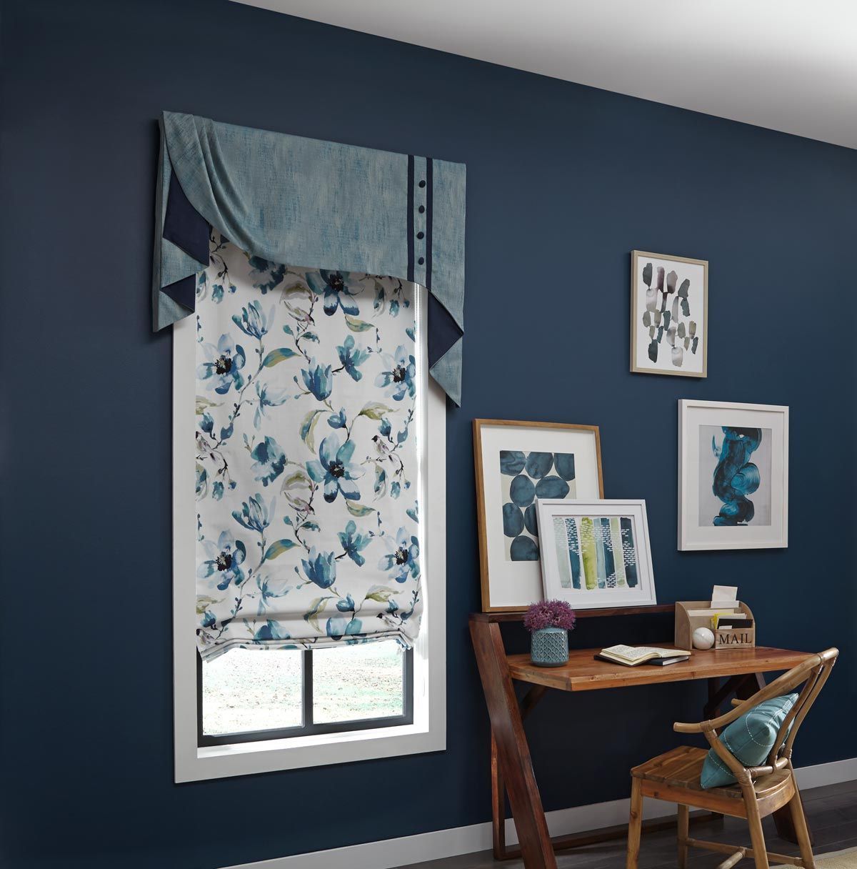 a room with blue walls and a desk and chair with a roman shade, drapery and a valance All Window Decor (817) 448-3393