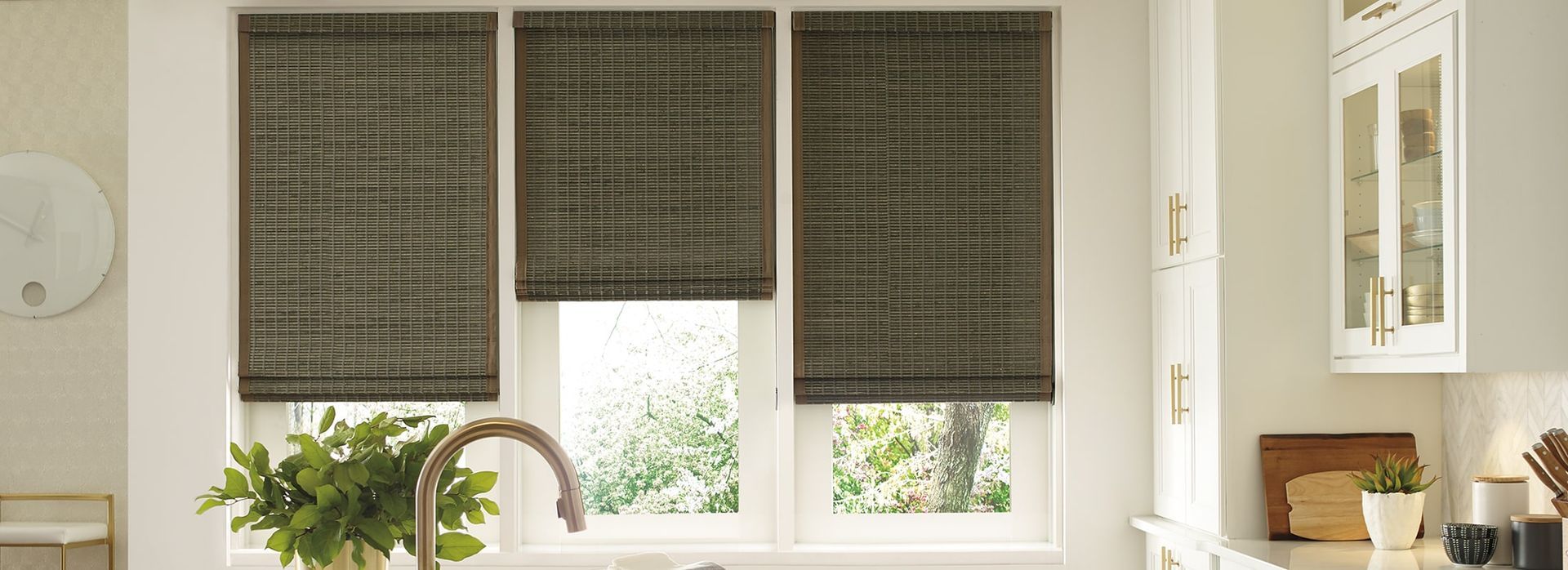a kitchen with a sink and a window with  woven wood shades All Window Decor (817) 448-3393.