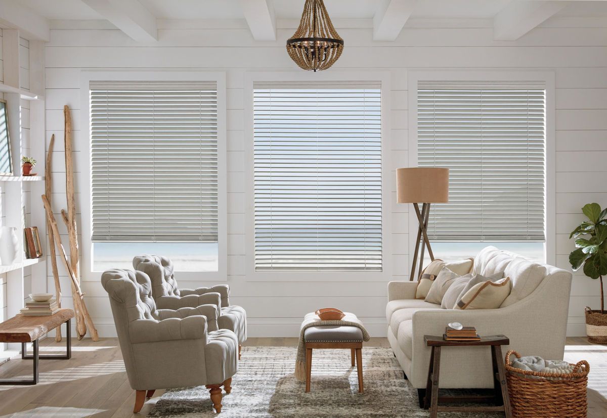 a living room with a couch , chairs , and striped blinds All Window Decor (817) 448-3393.